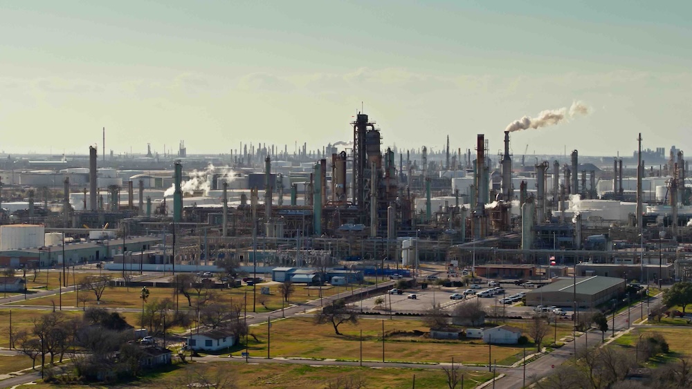 A chemical plant explosion in Shepherd, Texas sends a black plume of smoke into the air.