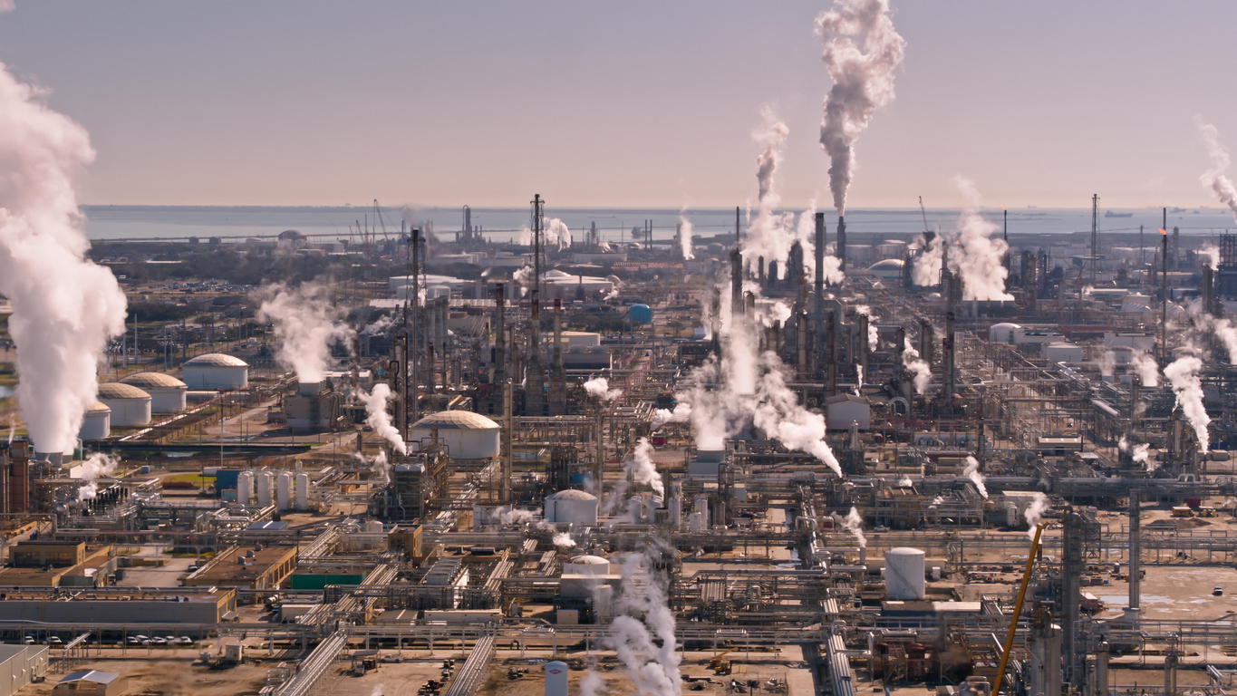 A chemical plant overlooks a body of water. Texas leads the nation in chemical accidents at locations like this.