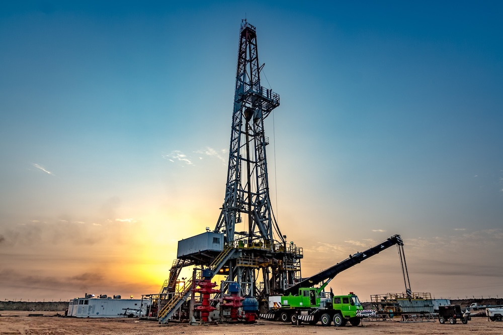 An oil rig at sunset. Oilfield explosion in Burleson County, Texas caused by lack of oversight and lax safety measures.