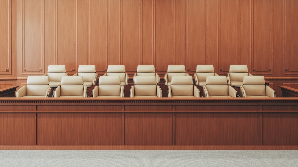 An empty courtroom jury box.